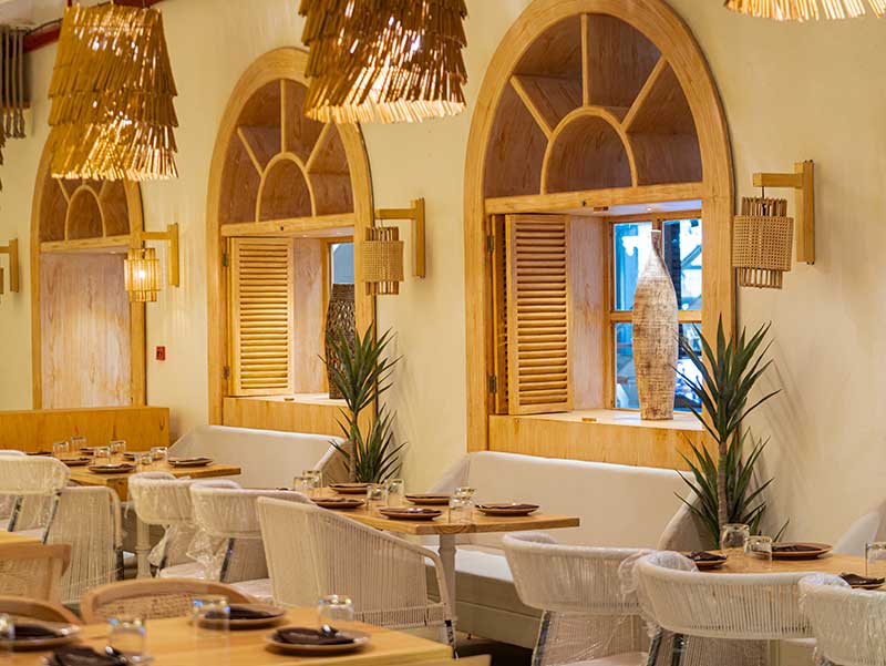 Koa Restaurant's cosy bohemian-inspired bar and dining area in Thane" | "Signature cocktails at Koa Restaurant near me" | "Premium dining experience at best bar and restaurant in Thane